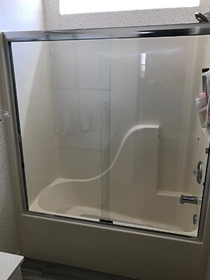 Sliding tub door